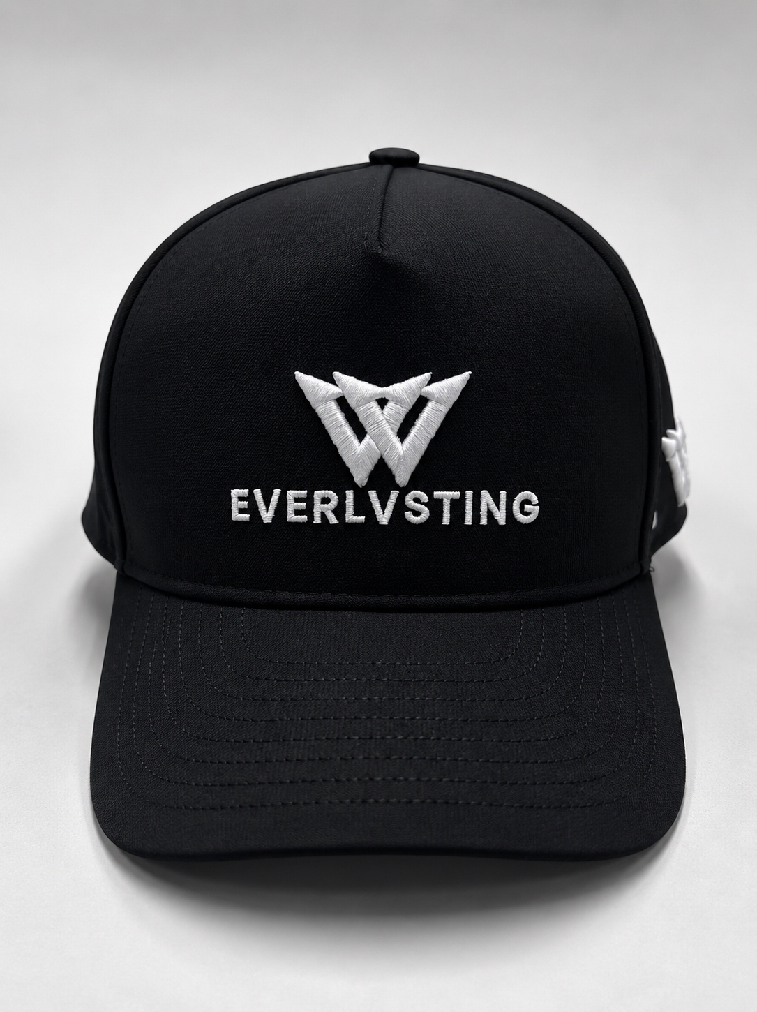 EVERLVSTING performance hat — front view with embroidered monogram